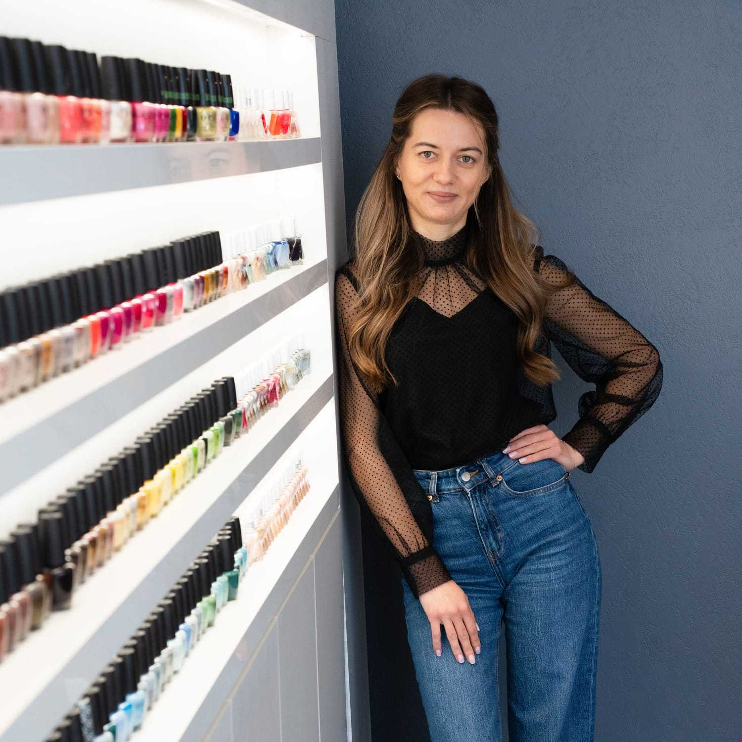 Portrait of Tamila, a professional stylist at Above All Grand Salon & Spa, showcasing their expertise and style.