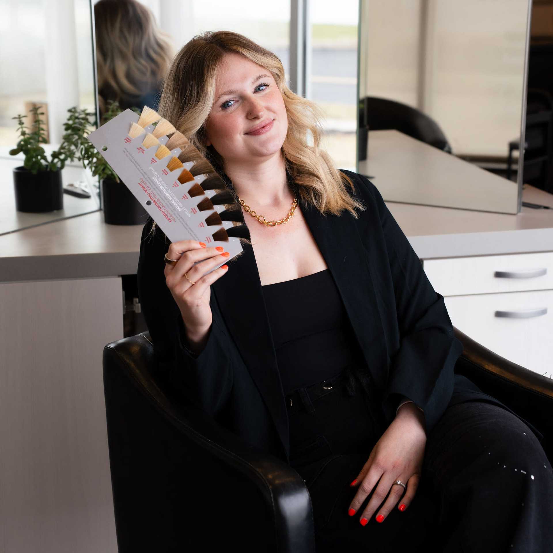 Portrait of Alyssa, a professional stylist at Above All Grand Salon & Spa, showcasing their expertise and style.