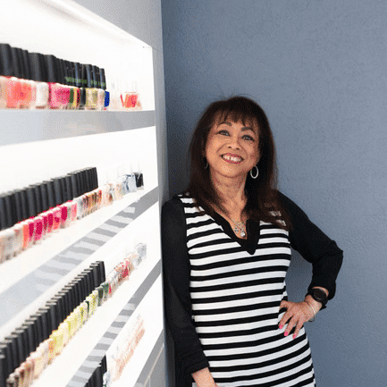 Portrait of Supinya, a professional stylist at Above All Grand Salon & Spa, showcasing their expertise and style.