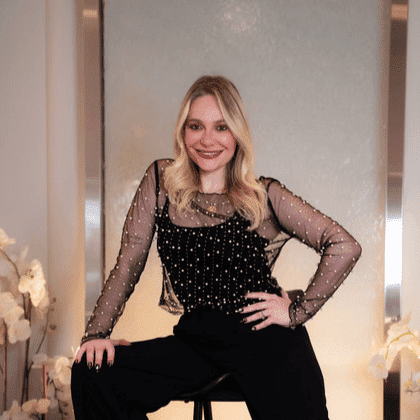 Portrait of Larissa, a professional stylist at Above All Grand Salon & Spa, showcasing their expertise and style.