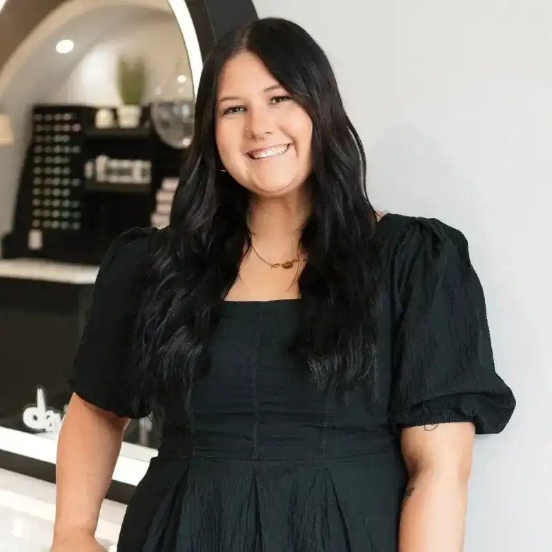 Portrait of Brooklyn, a professional stylist at Bonjour Belle Salon, showcasing their expertise and style.