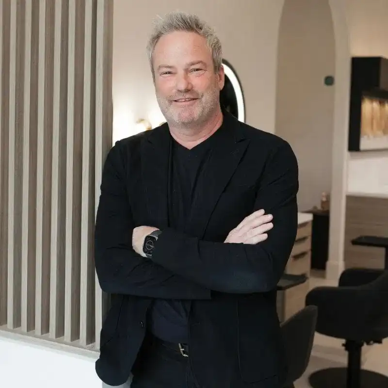 Portrait of Tim, a professional stylist at Bonjour Belle Salon, showcasing their expertise and style.