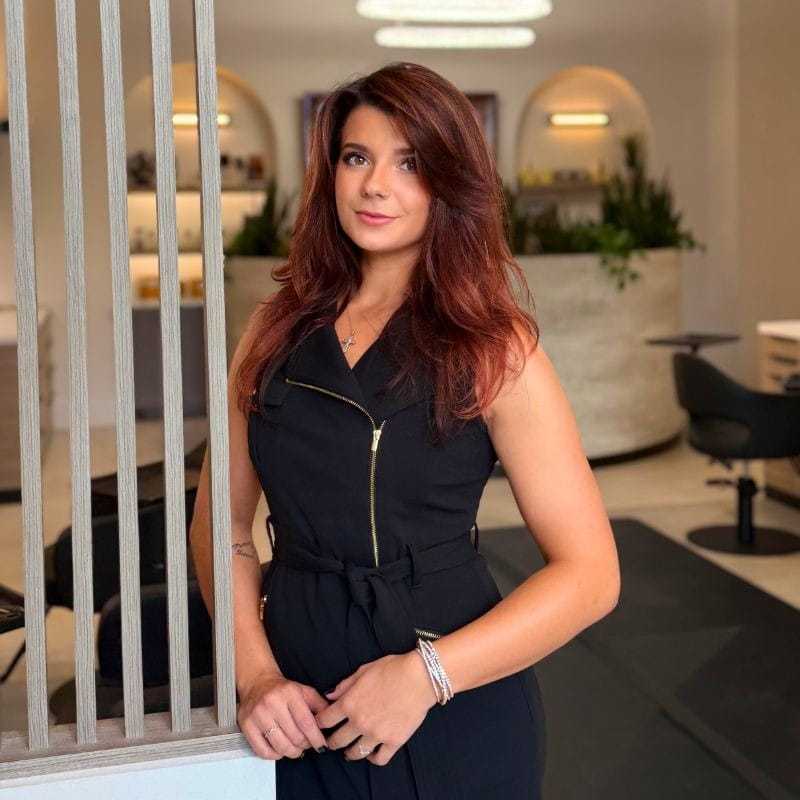 Portrait of Ashley, a professional stylist at Bonjour Belle Salon, showcasing their expertise and style.