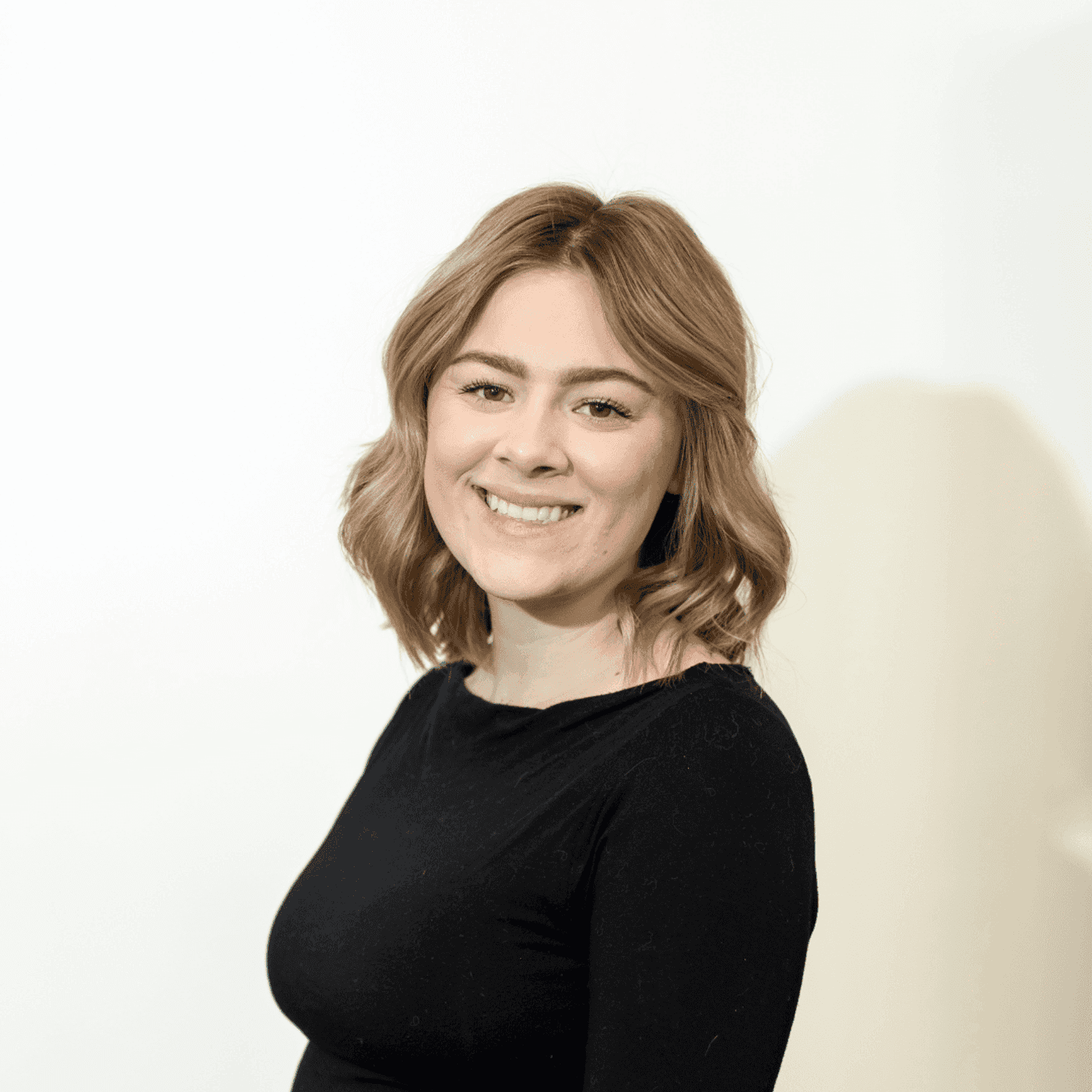 Portrait of Mckenna Richardson, a professional stylist at Brown & DeLine Salon, showcasing their expertise and style.