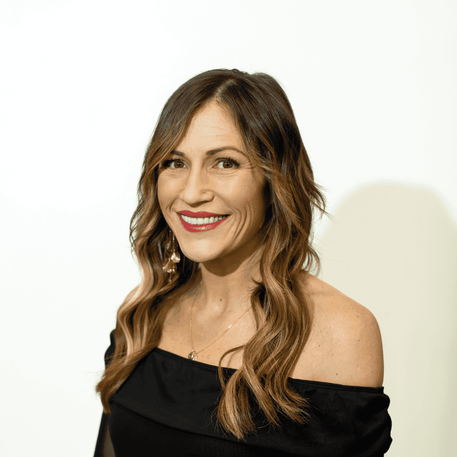 Portrait of Morgan Gelander, a professional stylist at Brown & DeLine Salon, showcasing their expertise and style.