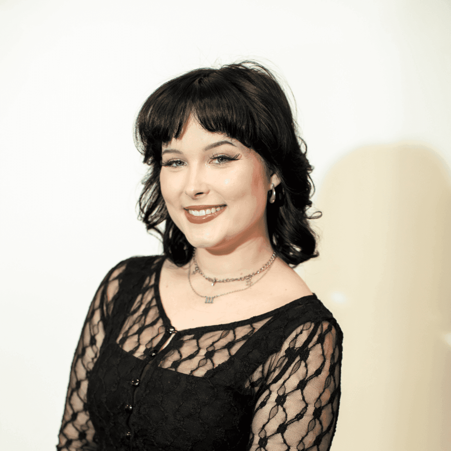 Portrait of Amy Adams, a professional stylist at Brown & DeLine Salon, showcasing their expertise and style.