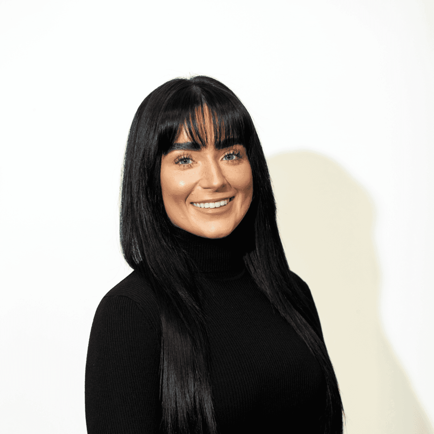 Portrait of Chloe Issel, a professional stylist at Brown & DeLine Salon, showcasing their expertise and style.