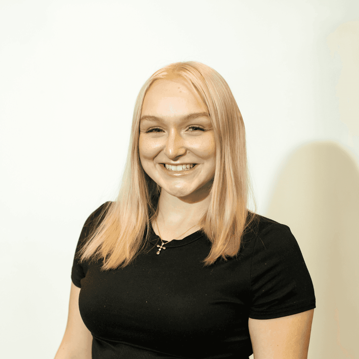 Portrait of Carly Daulton, a professional stylist at Brown & DeLine Salon, showcasing their expertise and style.