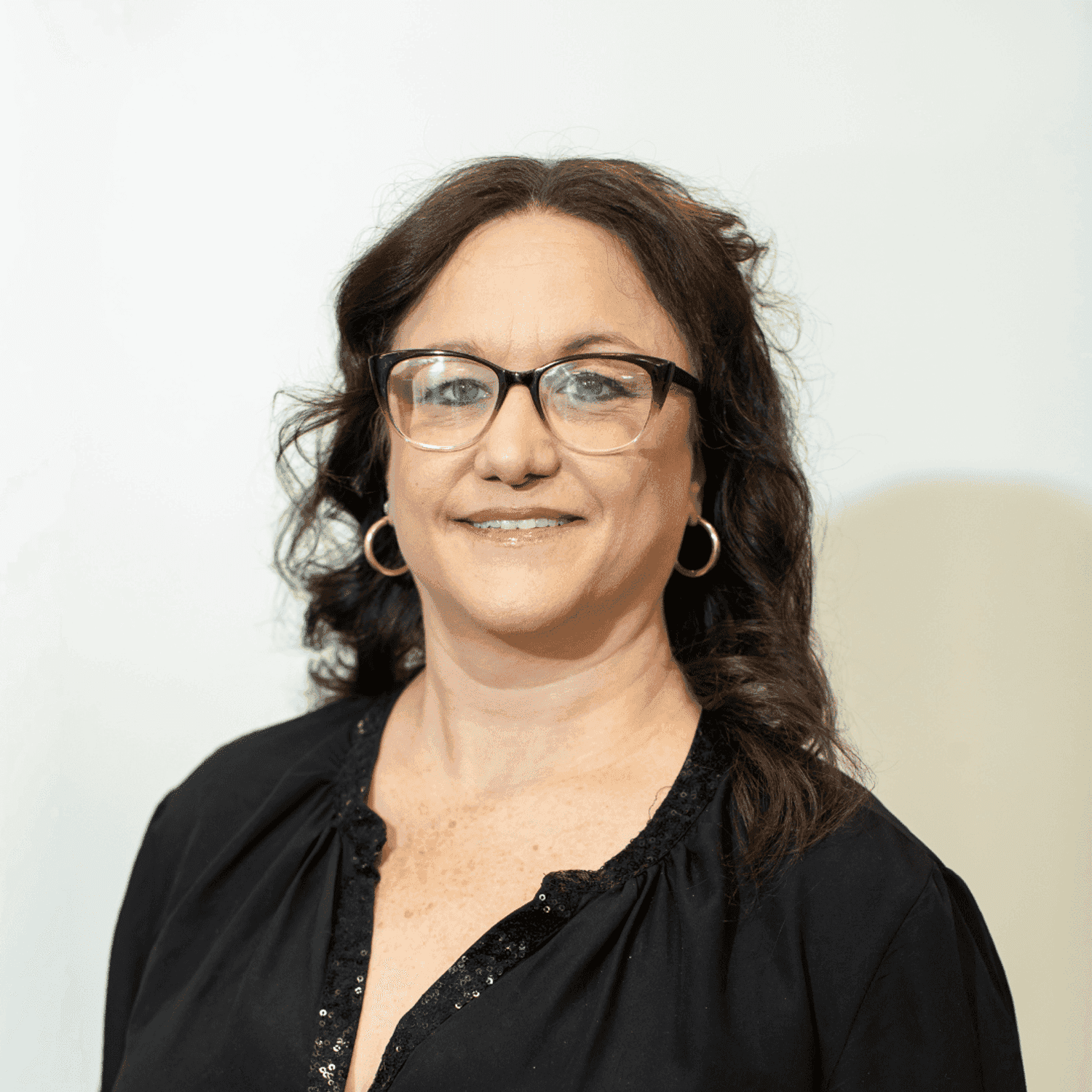 Portrait of Sarah Richardson, a professional stylist at Brown & DeLine Salon, showcasing their expertise and style.