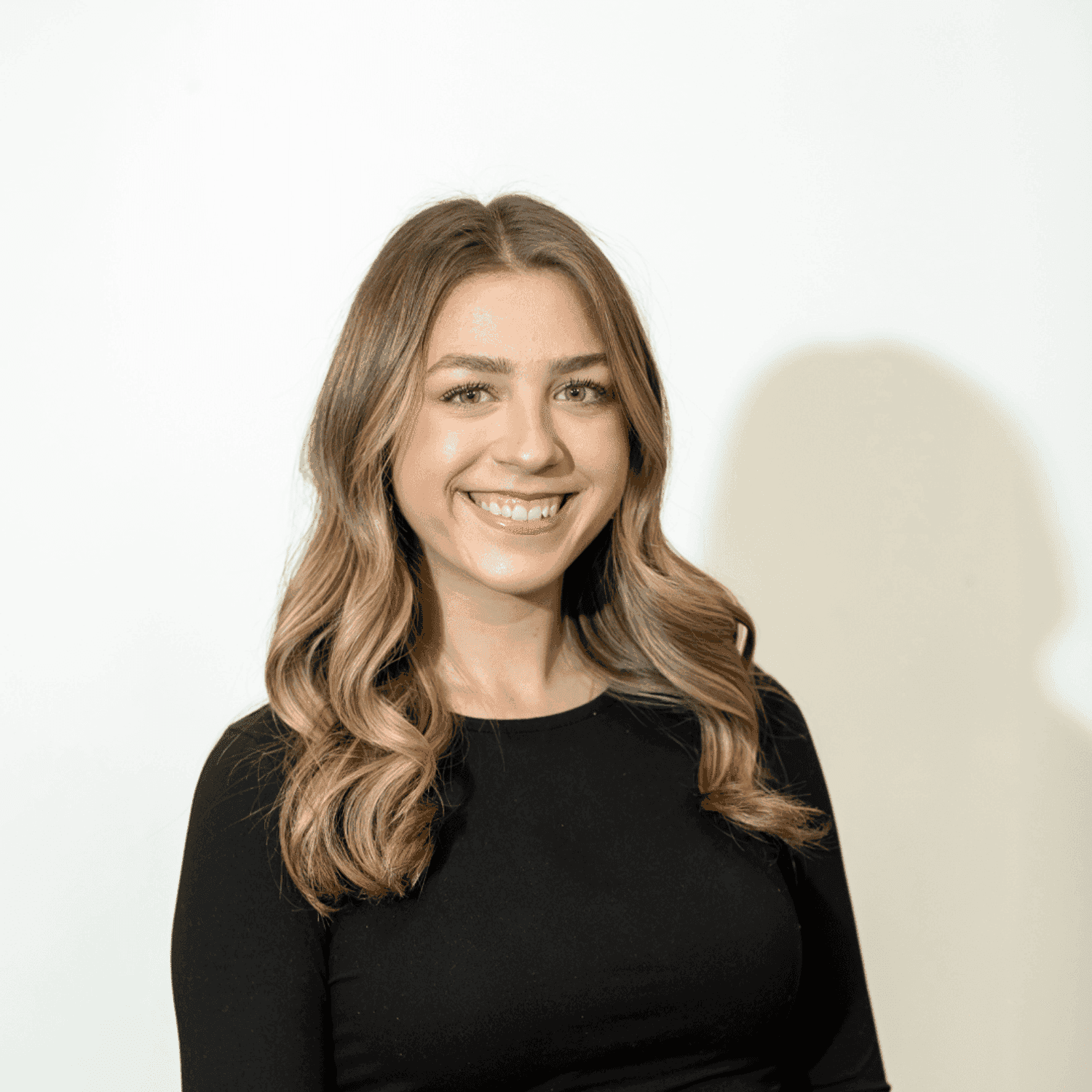 Portrait of Olivia Henry, a professional stylist at Brown & DeLine Salon, showcasing their expertise and style.