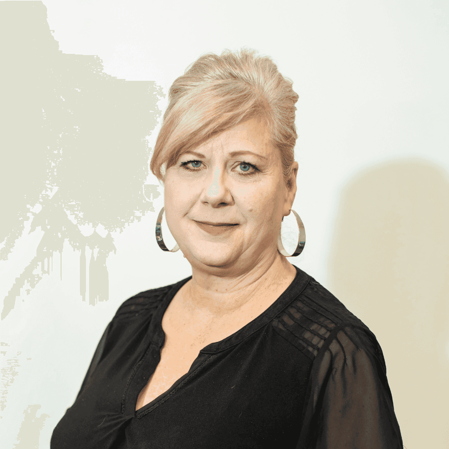 Portrait of Claire Osterberg, a professional stylist at Brown & DeLine Salon, showcasing their expertise and style.