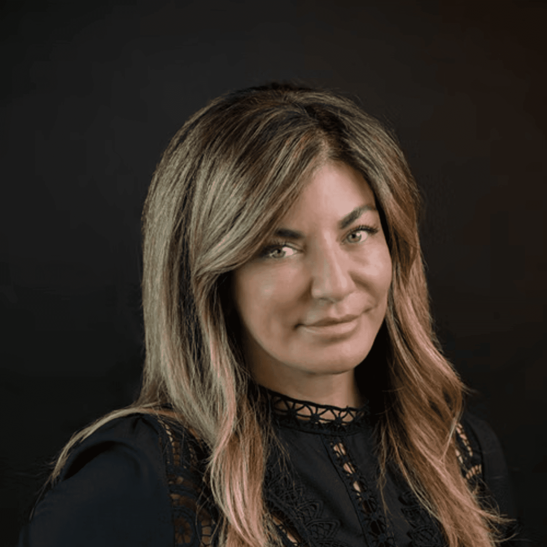 Portrait of Marietta, a professional stylist at Chad + Co., showcasing their expertise and style.