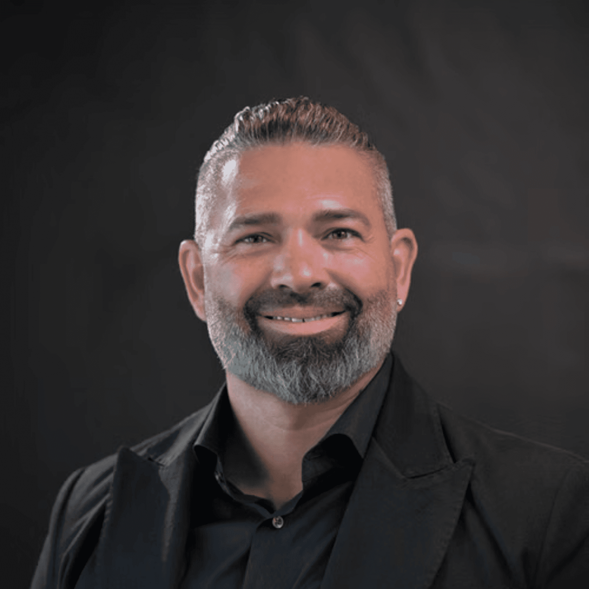 Portrait of Chad, a professional stylist at Chad + Co., showcasing their expertise and style.