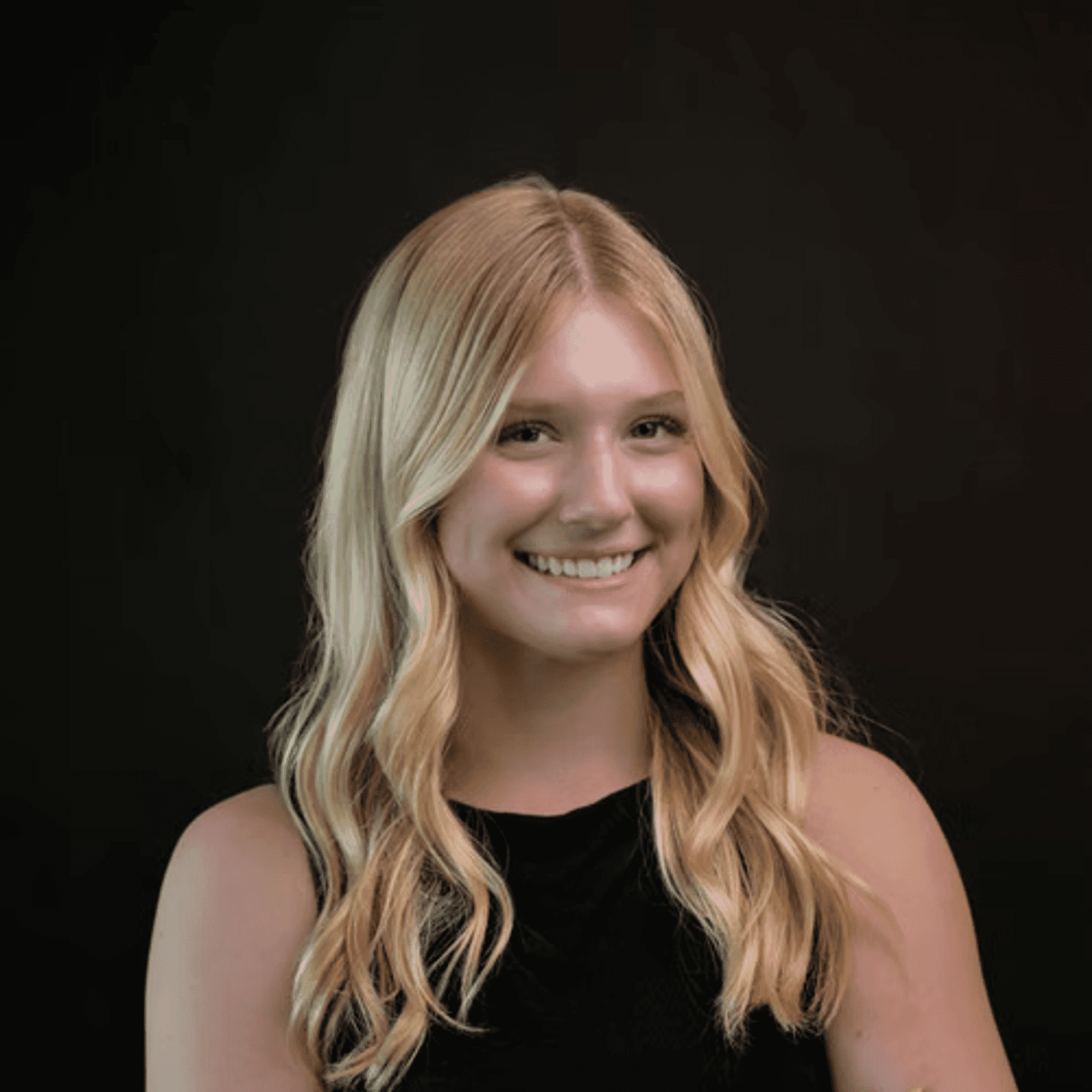 Portrait of Rowan, a professional stylist at Chad + Co., showcasing their expertise and style.