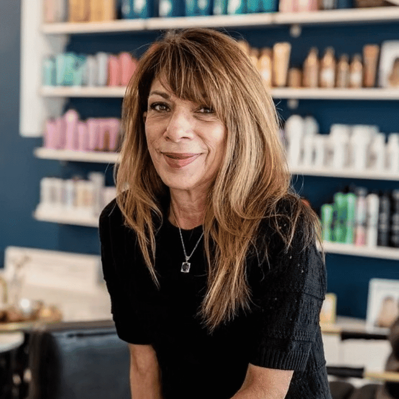 Portrait of Robin, a professional stylist at DBK Hair Studio, showcasing their expertise and style.