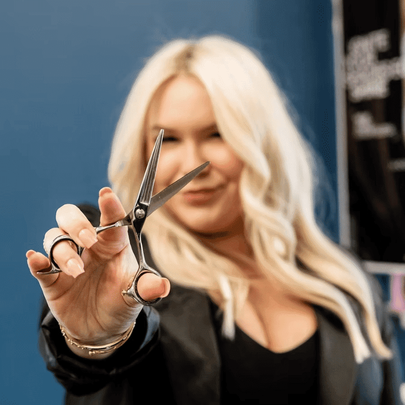 Portrait of Kelsey, a professional stylist at DBK Hair Studio, showcasing their expertise and style.