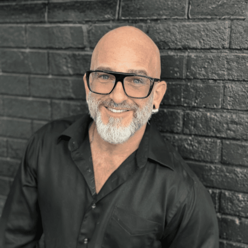 Portrait of Jerry Haughton, a professional stylist at Educe Salon, showcasing their expertise and style.