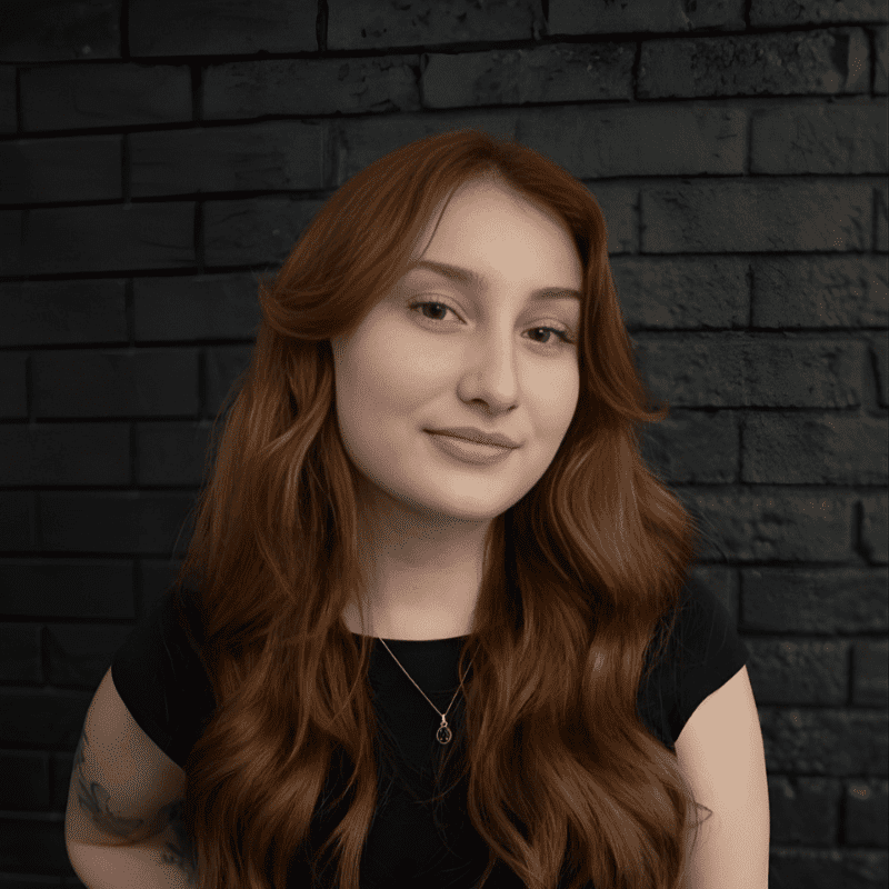 Portrait of Katana Star, a professional stylist at Educe Salon, showcasing their expertise and style.