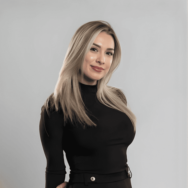 Portrait of Jennifer Verella, a professional stylist at Educe Salon, showcasing their expertise and style.