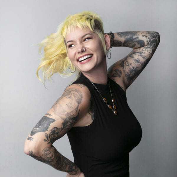 Portrait of Chelsea Ellen, a professional stylist at Educe Salon, showcasing their expertise and style.