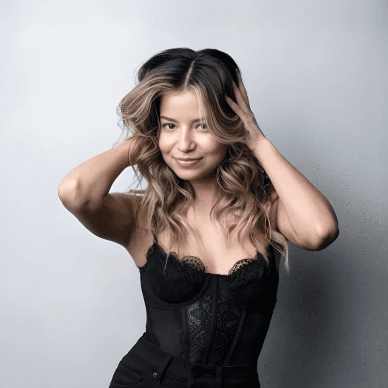 Portrait of Faviola Rosado, a professional stylist at Educe Salon, showcasing their expertise and style.