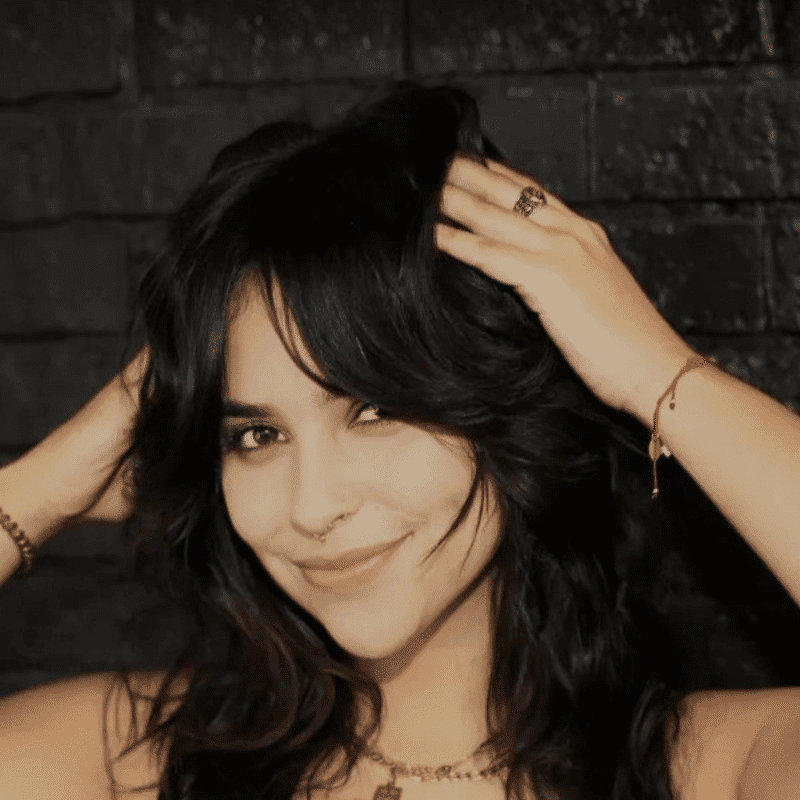 Portrait of Ori Calderon, a professional stylist at Educe Salon, showcasing their expertise and style.