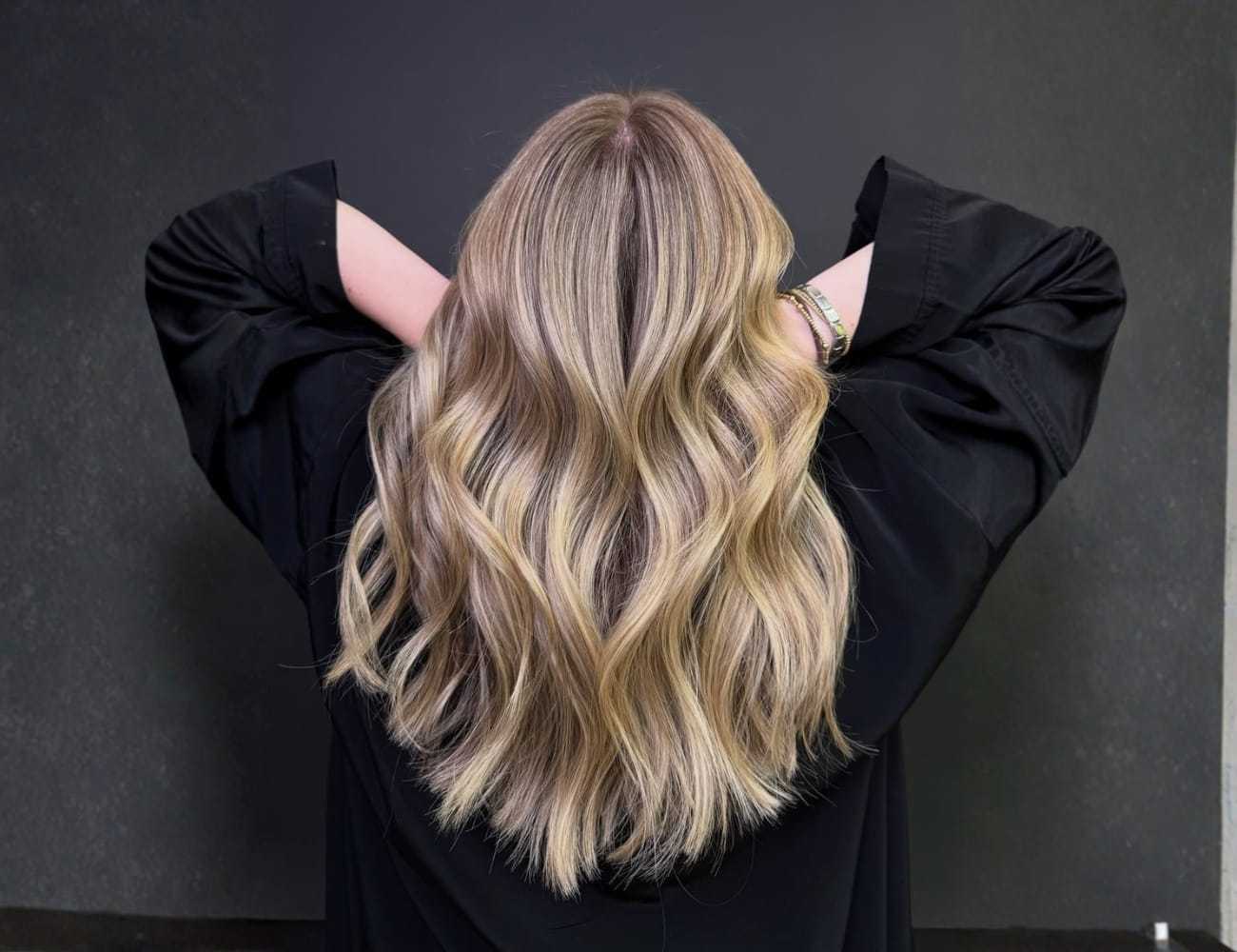 Blonde hair with loose waves, viewed from behind.