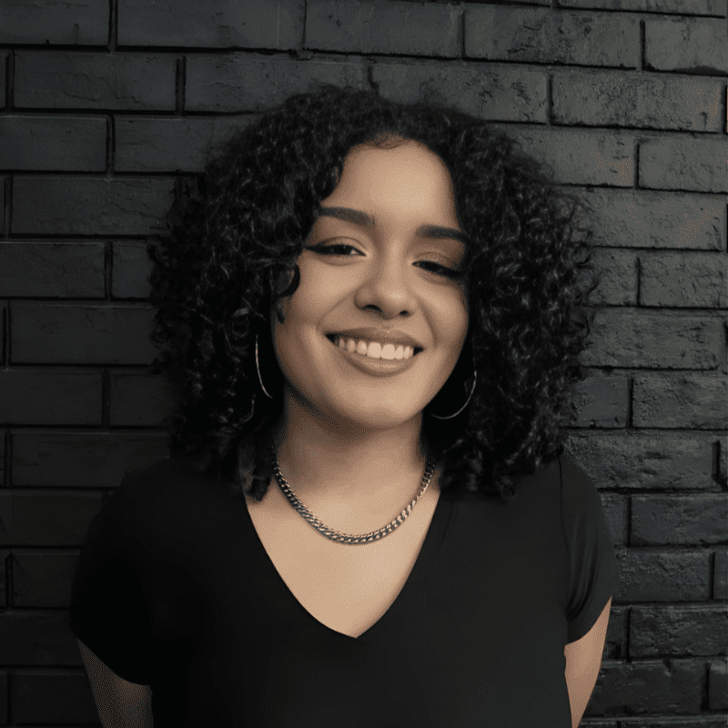 Portrait of Alexi Olivo, a professional stylist at Educe Salon, showcasing their expertise and style.