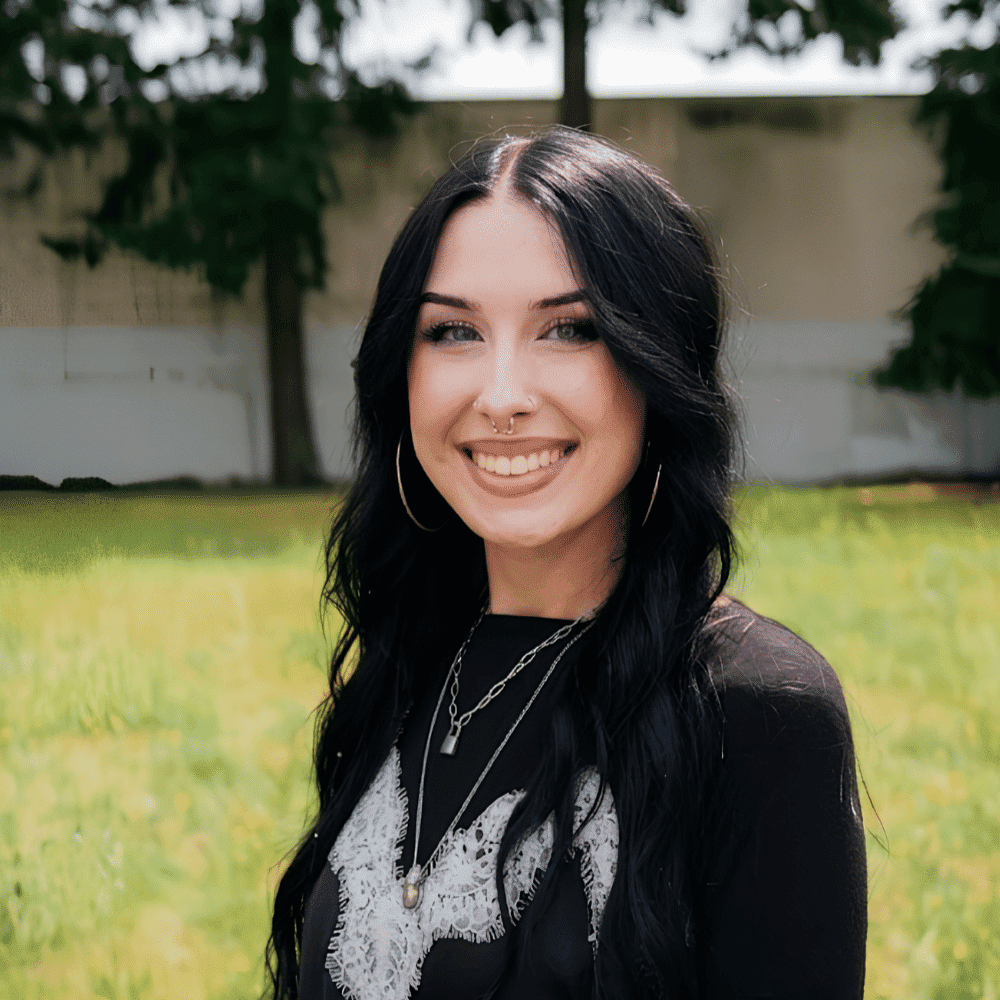 Portrait of Kylee Zapata, a professional stylist at Hair Lounge, showcasing their expertise and style.