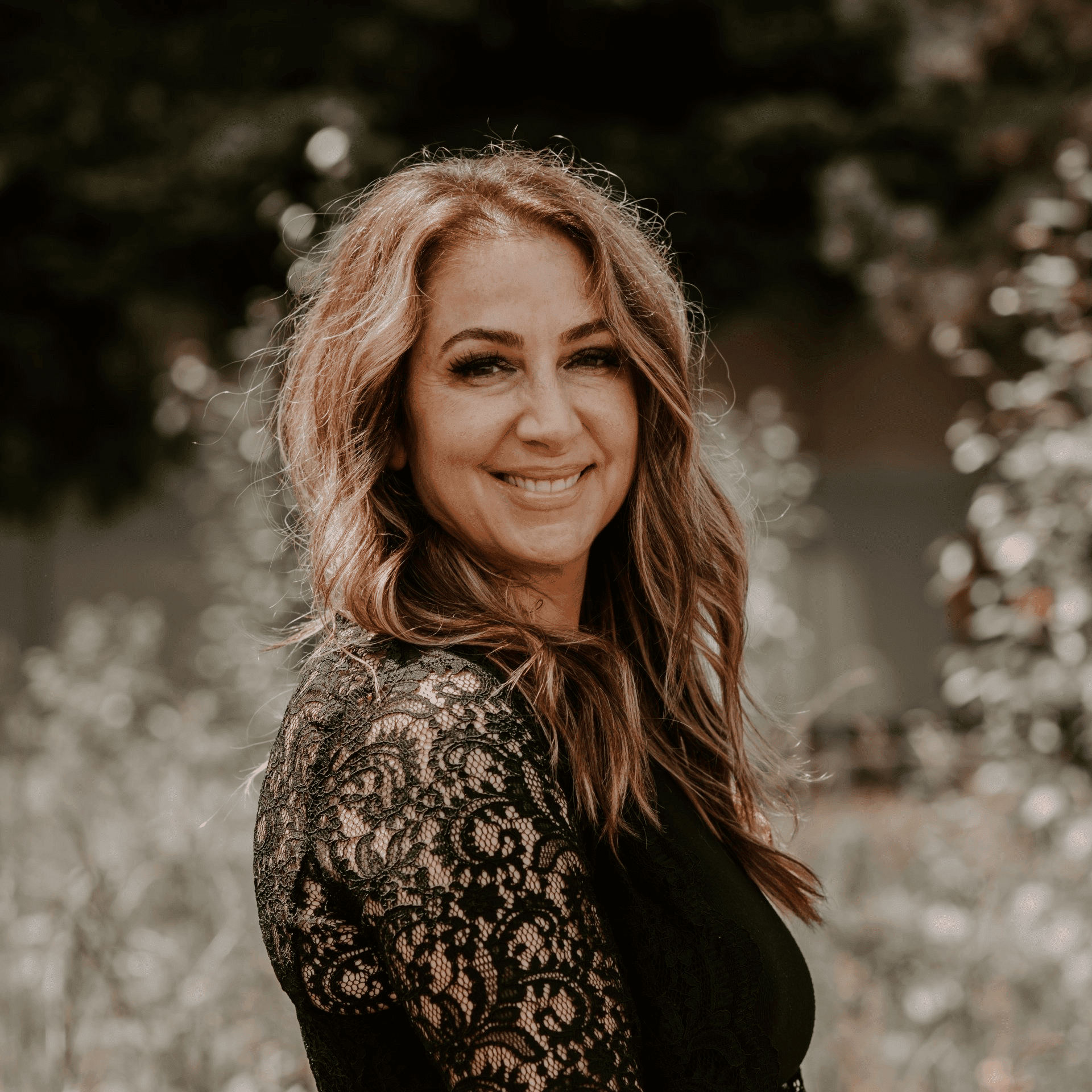 Portrait of Patty Seaver, a professional stylist at Hair Lounge, showcasing their expertise and style.