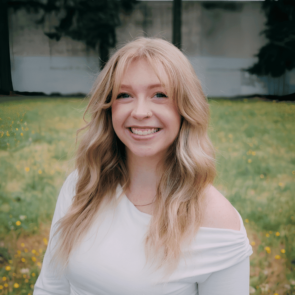 Portrait of Emily Panush, a professional stylist at Hair Lounge, showcasing their expertise and style.