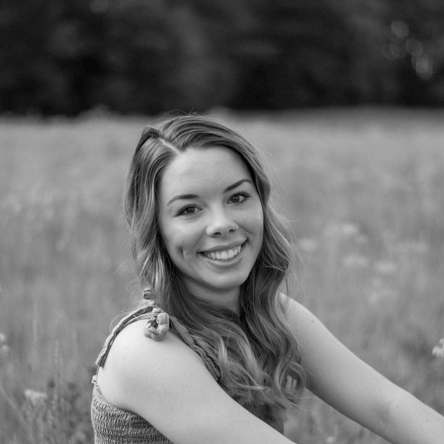 Portrait of Savanna, a professional stylist at Indigo, showcasing their expertise and style.