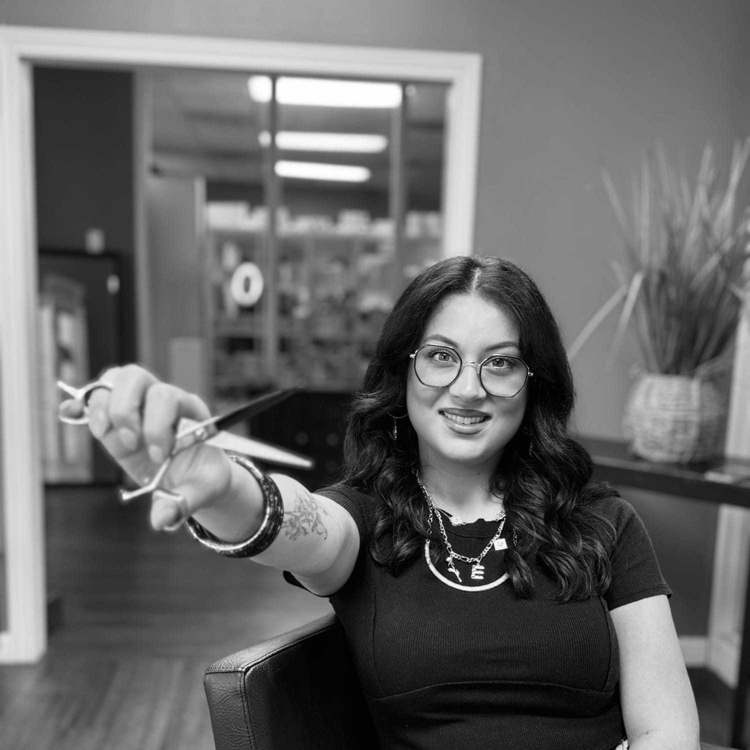Portrait of Emily, a professional stylist at Indigo, showcasing their expertise and style.