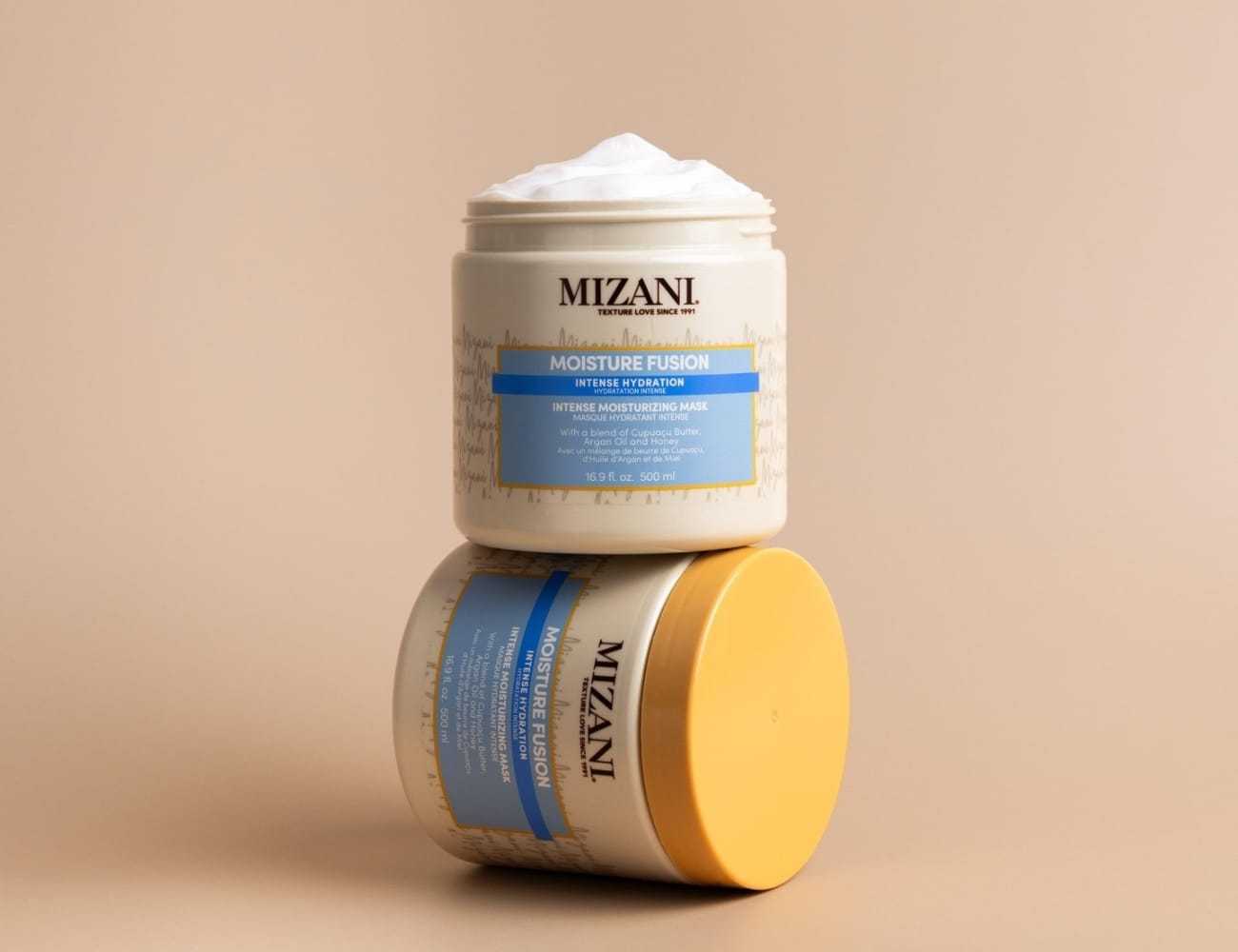 Hydrating hair mask by Mizani in beige and blue packaging on a neutral background.