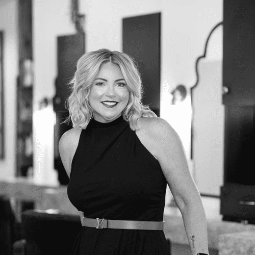 Portrait of Lisa, a professional stylist at Jungle Red Salon, showcasing their expertise and style.