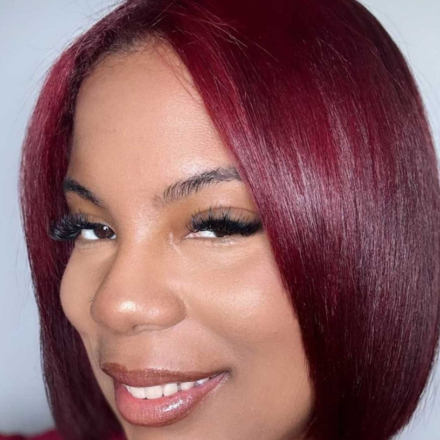 Portrait of Aliyah Stallworth, a professional stylist at Noir et Blanc Salon, showcasing their expertise and style.