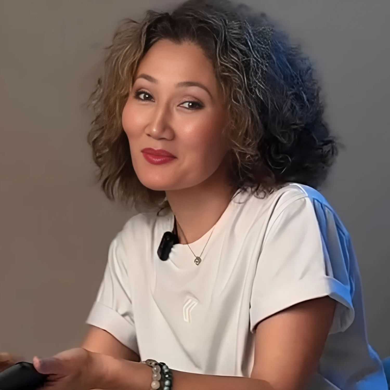 Portrait of Gulnara, a professional stylist at Noir et Blanc Salon, showcasing their expertise and style.