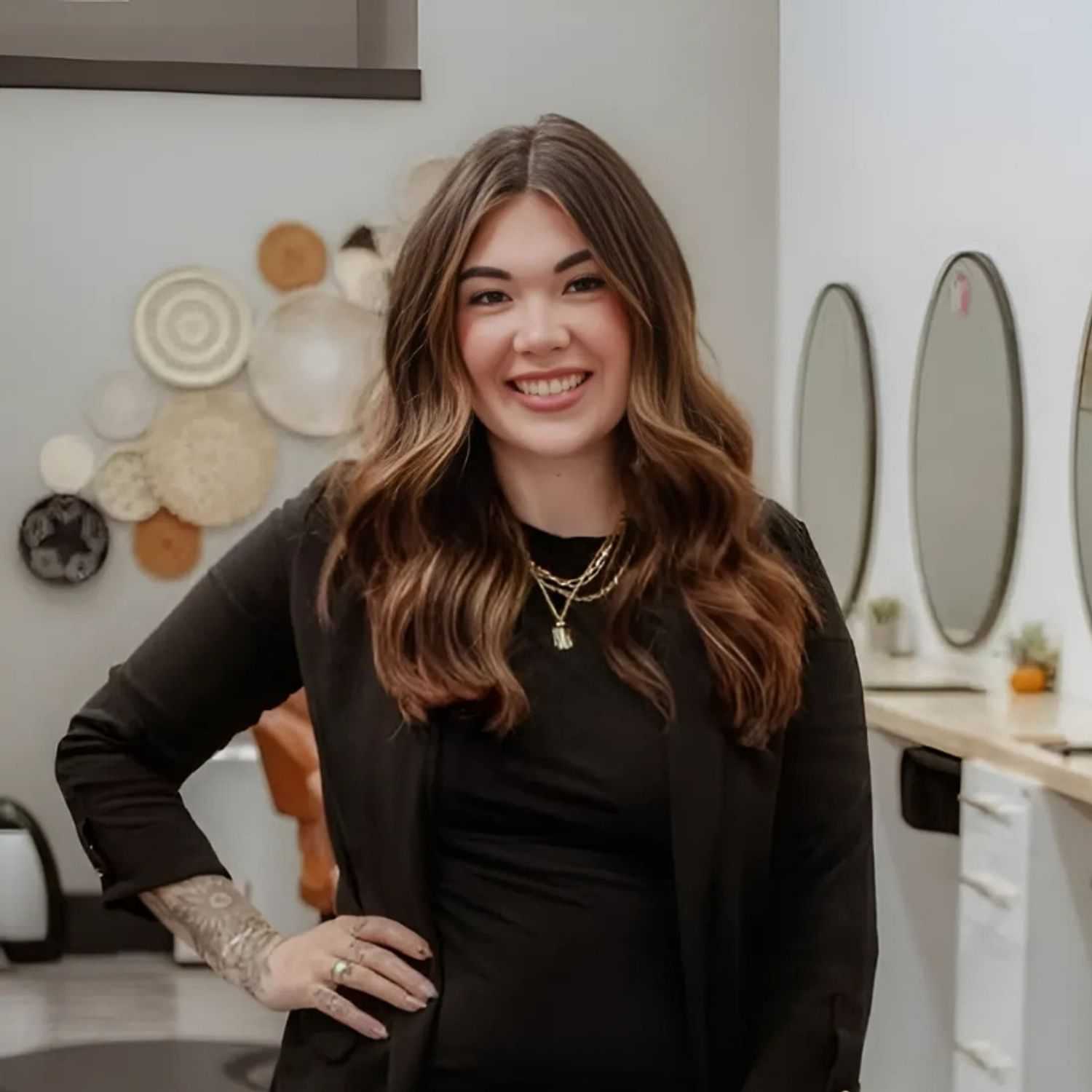 Portrait of Alexus, a professional stylist at Posh Salon And Boutique, showcasing their expertise and style.