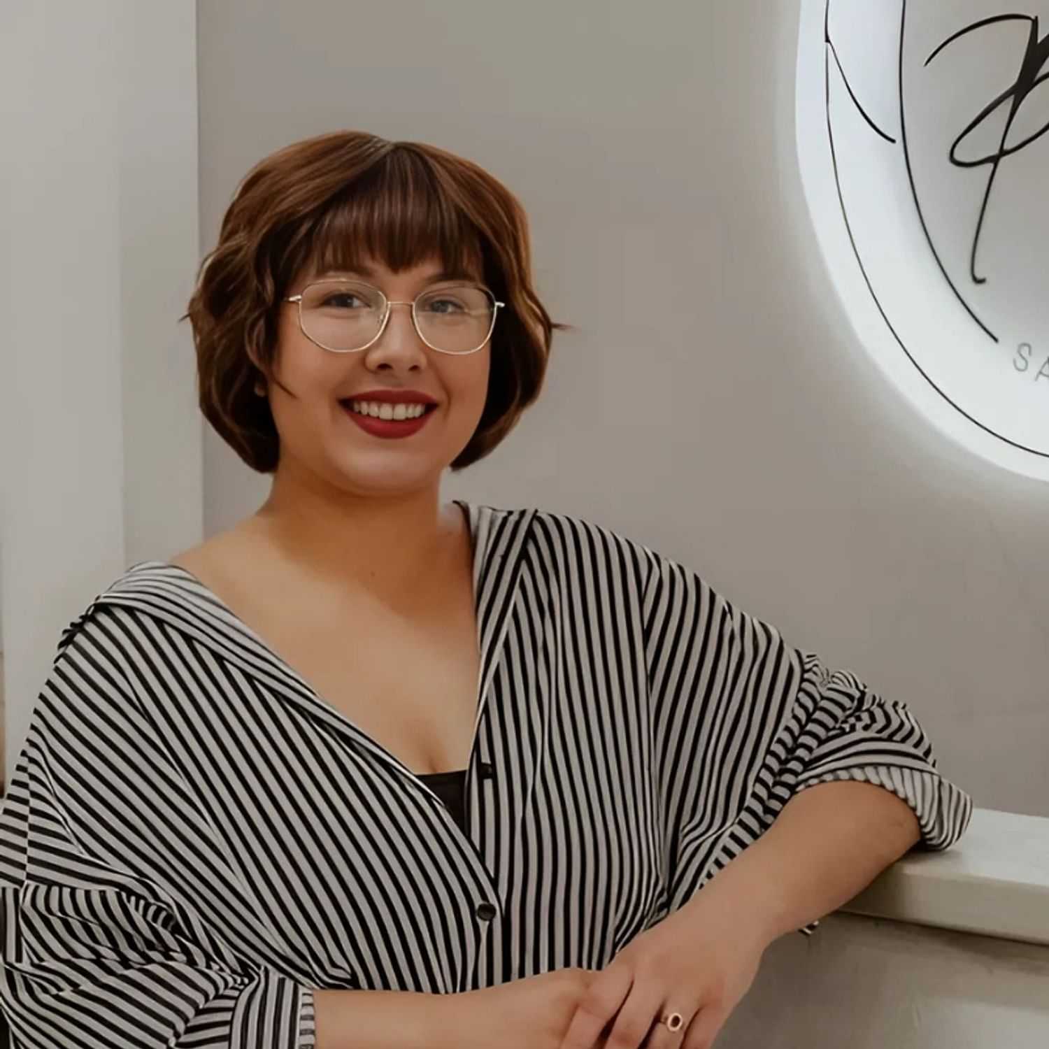 Portrait of Amara, a professional stylist at Posh Salon And Boutique, showcasing their expertise and style.