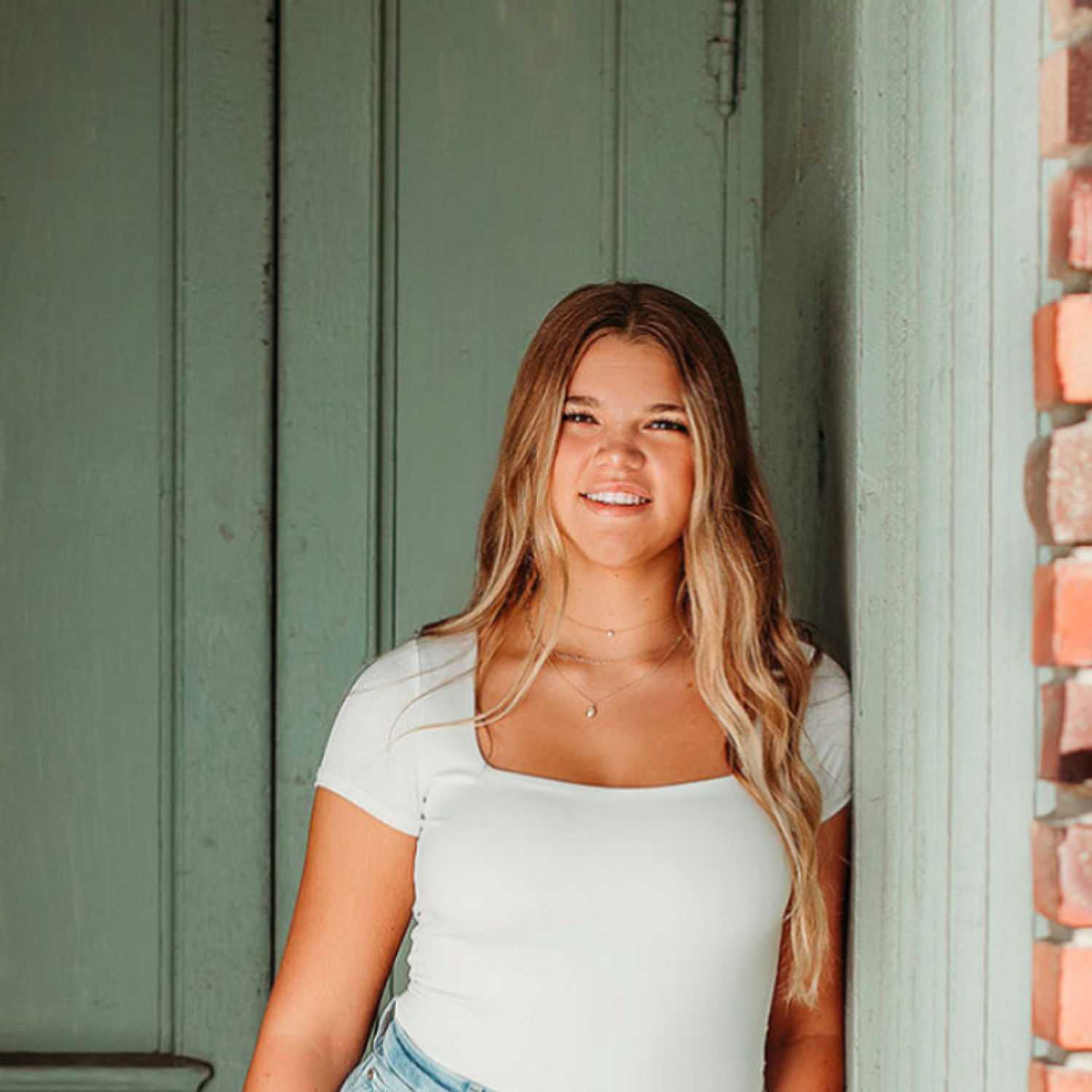 Portrait of Addisyn Bacon, a professional stylist at Revive Hair Salon & Day Spa, showcasing their expertise and style.