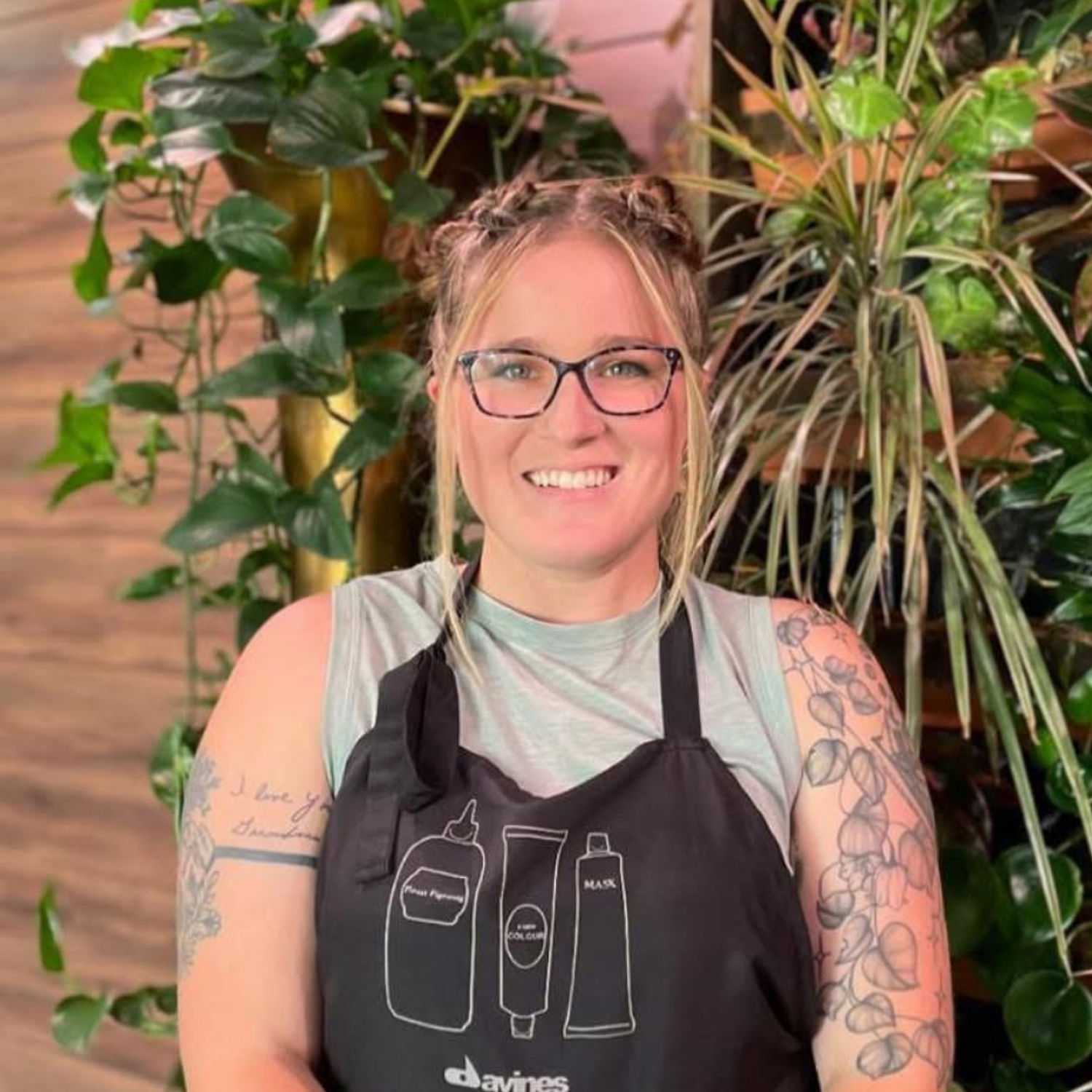 Portrait of Maddy Timmerman, a professional stylist at Revive Hair Salon & Day Spa, showcasing their expertise and style.