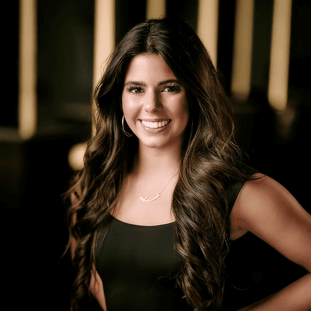 Portrait of Adriana, a professional stylist at Salon Bliss & Spa, showcasing their expertise and style.