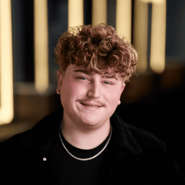 Portrait of Logan, a professional stylist at Salon Bliss & Spa, showcasing their expertise and style.