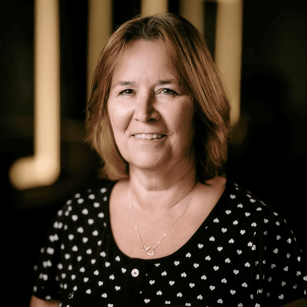 Portrait of Cathy, a professional stylist at Salon Bliss & Spa, showcasing their expertise and style.
