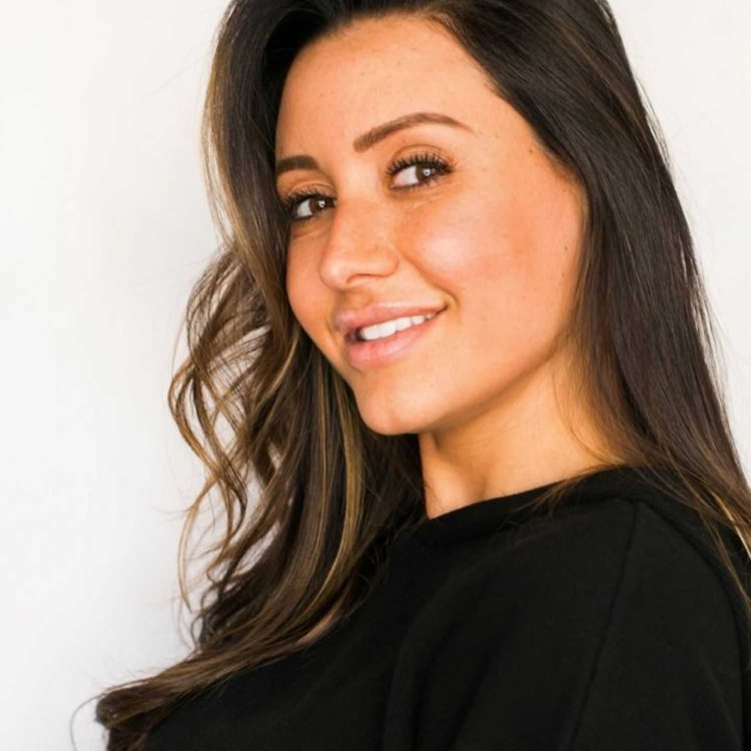 Portrait of Jay, a professional stylist at [salon] 718, showcasing their expertise and style.