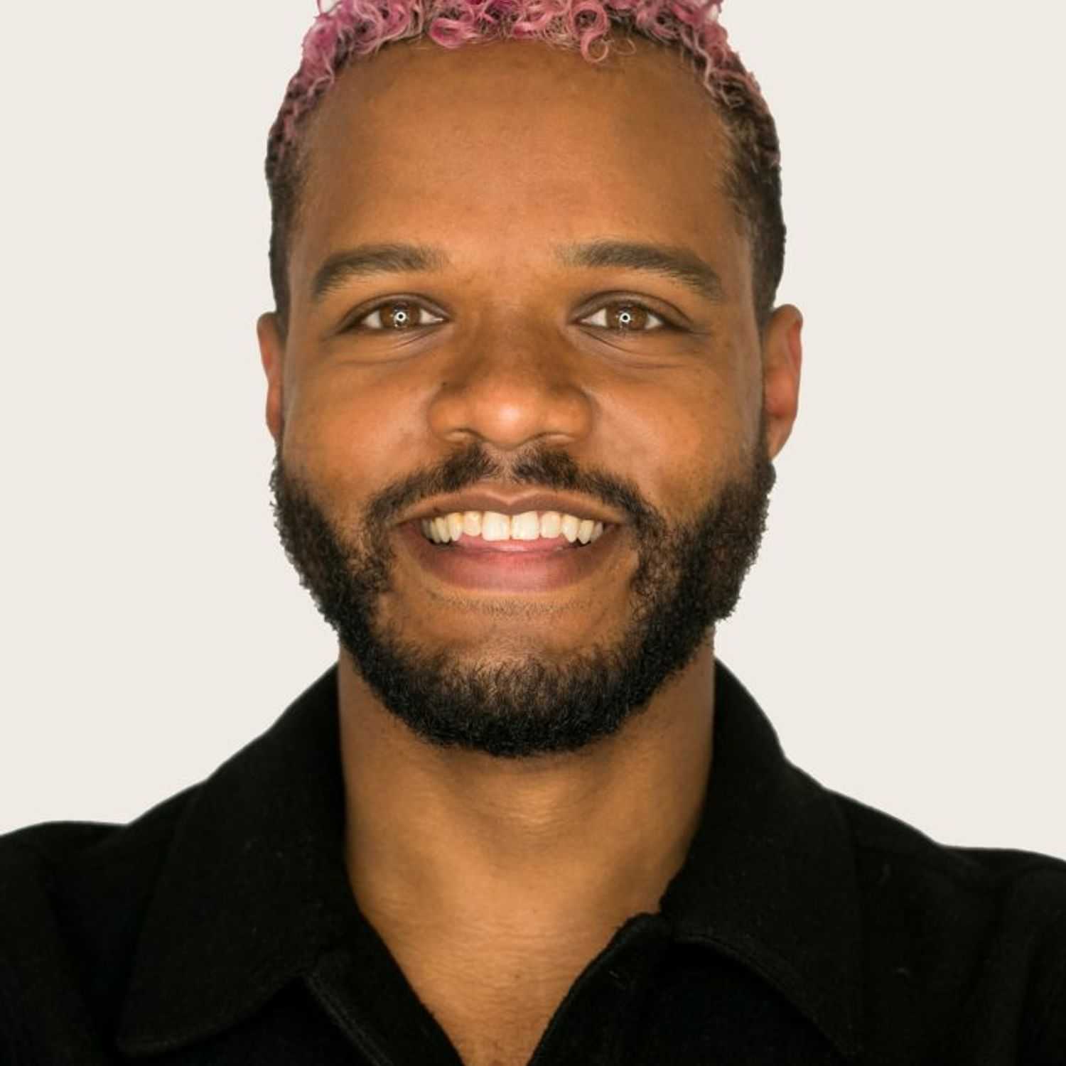 Portrait of Juan, a professional stylist at [salon] 718, showcasing their expertise and style.