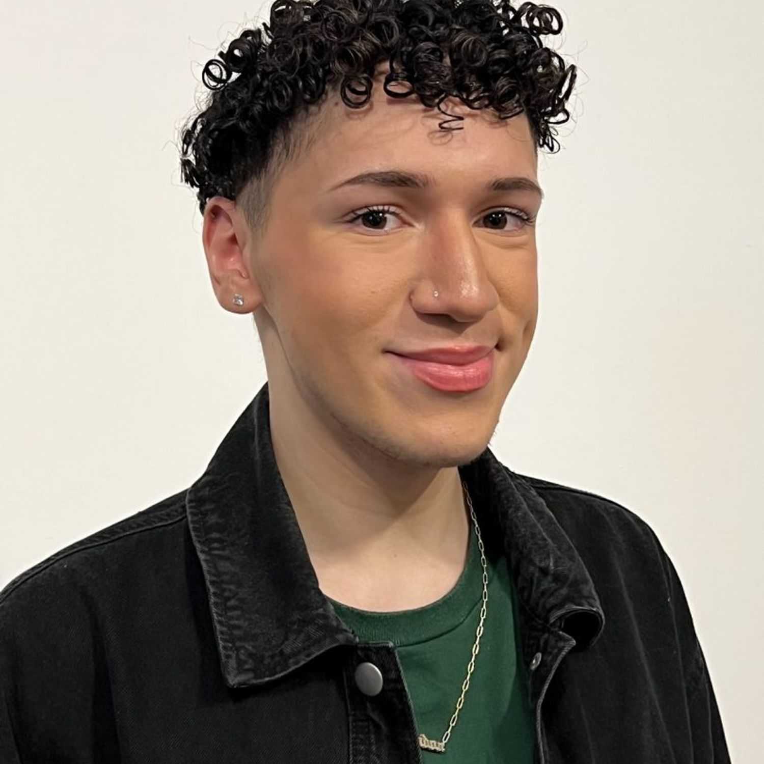 Portrait of Brandon, a professional stylist at [salon] 718, showcasing their expertise and style.