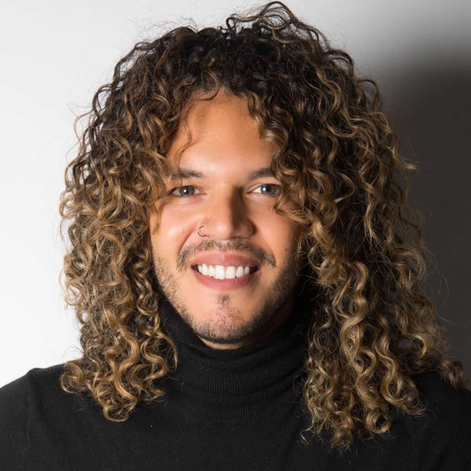 Portrait of Jonathan, a professional stylist at [salon] 718, showcasing their expertise and style.