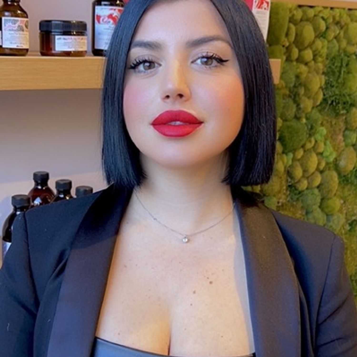 Portrait of Giulia, a professional stylist at [salon] 718, showcasing their expertise and style.