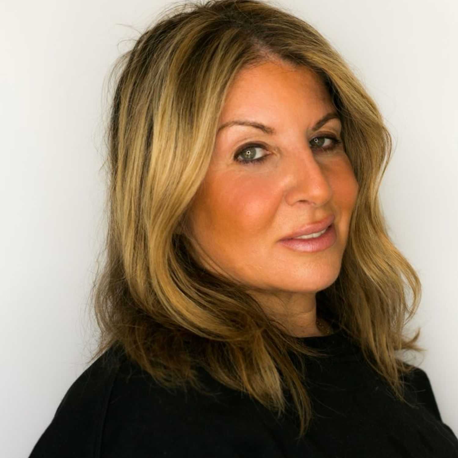 Portrait of Jovi, a professional stylist at [salon] 718, showcasing their expertise and style.